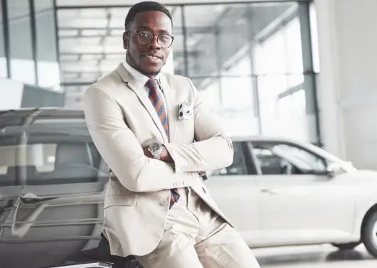 Lemco Motors and Insurance consultant at a vehicle showroom